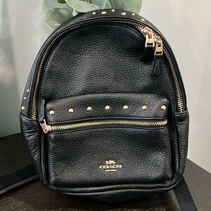 Pre-owned COACH mini backpack.
